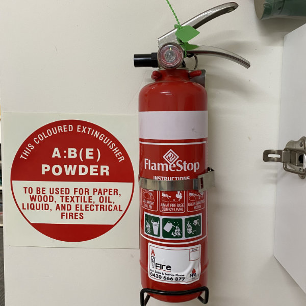 Wall-mounted-fire-extinguisher-with-sign